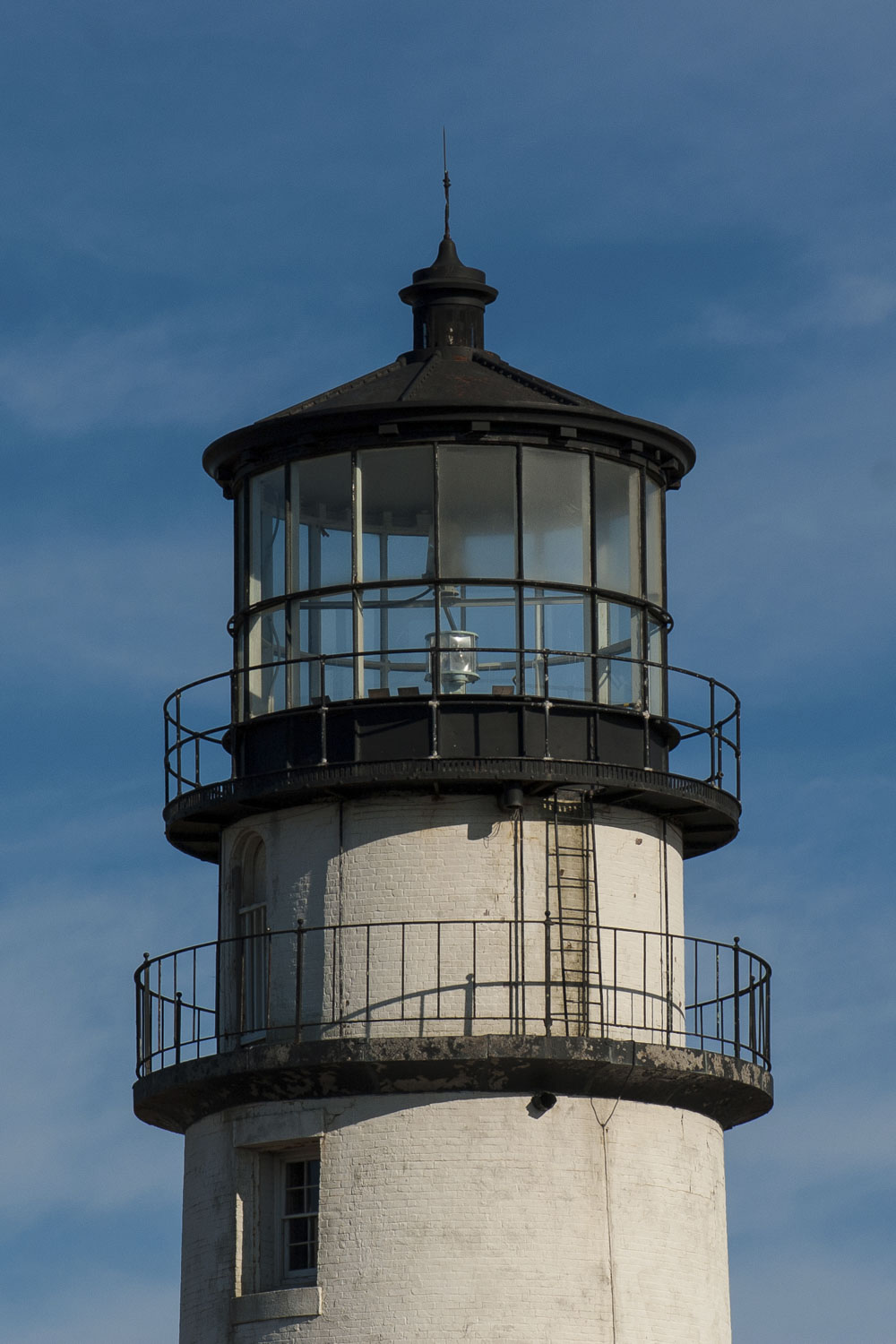 Top portion of a lighthouse with 2 walkways.